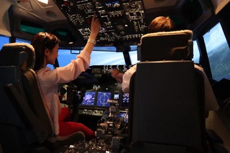 a person standing in front of a computer